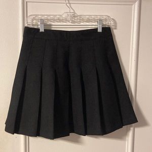 Black, pleated miniskirt